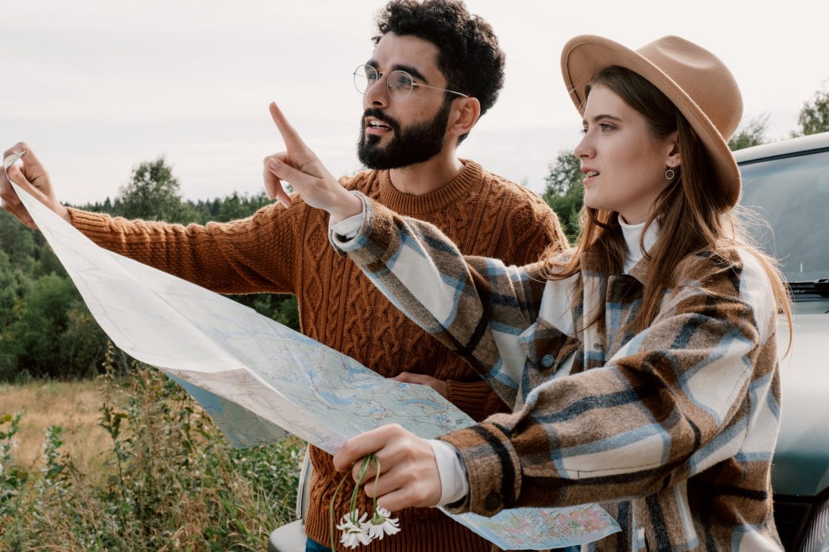 a couple holding a map